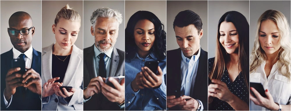 Photo of people checking their smartphones